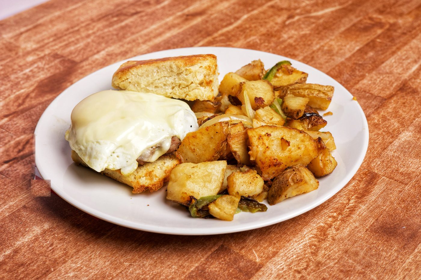 Honey butter biscuit sandwich with breakfast potatoes